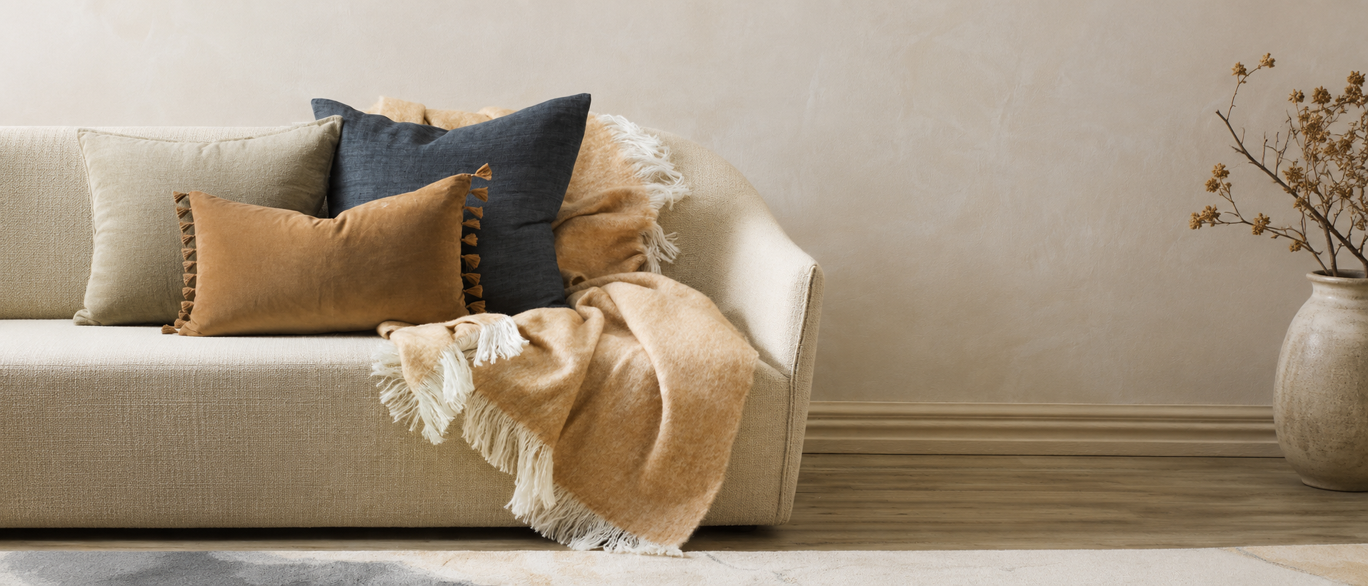 Soft cushions and throws in a calm living room